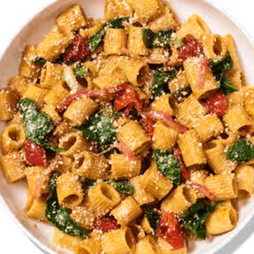 Rigatoni noodles in balsamic vinaigrette, roasted garlic, red onion, tomatoes and spinach, topped with parmesan.